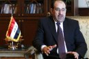 Iraq's Prime Minister Nouri Maliki gestures during talks with his Egyptian counterpart Ahmed Nazif in Cairo