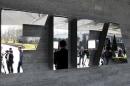 Journalists are reflected in the FIFA logo as they wait for a news conference after meeting of FIFA executive committee in Zurich