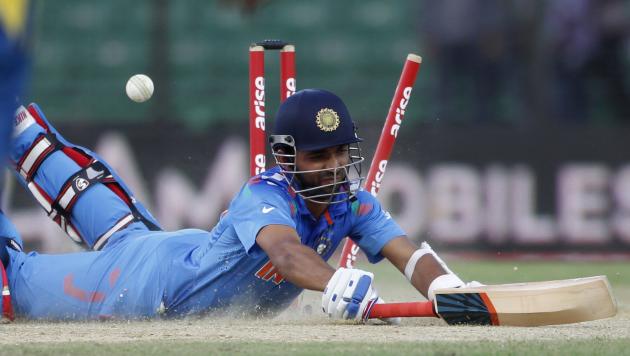 India&#39;s Rahane jumps to avoid a run out against Sri Lanka during their one-day international cricket match at the Asia Cup 2014 in Fatullah