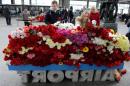 Mourners lay flowers at Pulkovo International Airport outside St. Petersburg on November 1, 2015 as Russia mourned its biggest-ever air disaster, a crash in Egypt that claimed 224 lives