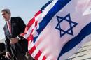 US Secretary of State John Kerry walks past American and Israeli flags at Ben Gurion International Airport in Tel Aviv on January 6, 2014