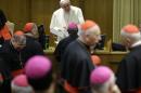 Pope Francis talks to prelates as he arrives at the morning session of a two-week synod on family issues at the Vatican, Saturday, Oct. 18, 2014. (AP Photo/Andrew Medichini)