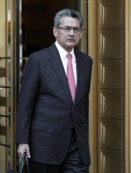 Former Goldman Sachs director Rajat Gupta leaves federal court in New York, Friday, June 15, 2012. Gupta, accused of feeding confidential information to a corrupt hedge fund manager, has been convicted of conspiracy and three counts of securities fraud. (AP Photo/Richard Drew)