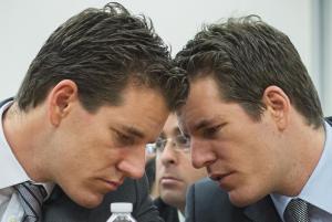 Brothers Cameron and Tyler Winklevoss talk to each …
