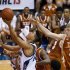 Chaminade forward Kevin Hu (23) drives to the basket as Texas forward Connor Lammert (21) defends during the first half of an NCAA college basketball game Monday, Nov. 19, 2012, in Lahaina, Hawaii. (AP Photo/Eugene Tanner)