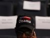 A delegate wearing a cap supporting President Barack Obama awaits the start of the first day of the Democratic National Convention in Charlotte