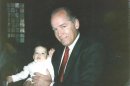 Undated handout photo of Bulger holding Martorano's youngest son, John Jr., during his Christening ceremony