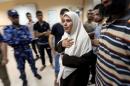 Palestinian woman reacts after wounded people were brought into the hospital following what witnesses said was an Israeli air strike in the central Gaza Strip