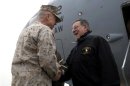 U.S. Defense Secretary Panetta is greeted by Marine General Allen upon his arrival at Kabul International Airport