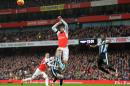 Arsenal's striker Olivier Giroud jumps against Newcastle United's defender Chancel Mbemba (R) during an English Premier League football match at the Emirates Stadium in London on January 2, 2016