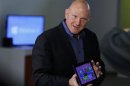 Microsoft CEO Steve Ballmer holds a tablet before the launch of Windows 8 operating system in New York
