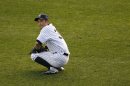 New York Yankees left fielder Ichiro Suzuki pauses during a break in play against the Detroit Tigers in the seventh inning of Game 2 of their MLB ALCS playoff baseball series in New York