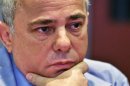Israeli Finance Minister Yuval Steinitz listens to a question during an interview in New York