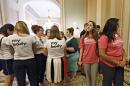 Women activists representing the National Women's Law Center, left, and Planned Parenthood, right, stand outside the Senate chamber after Senate Democrats' effort to proceed on the 