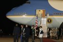 U.S. President Barack Obama (2nd L) arrives at Waterkloof Air Base in South Africa
