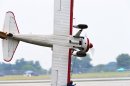 A stunt plane loses control as a wing walker performs at the Vectren Air Show just before crashing, Saturday, June 22, 2013, in Dayton, Ohio. The crash killed the pilot and the stunt walker instantly, authorities said. (AP Photo/Thanh V Tran)