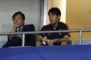 Japan's Kagawa watches his teammates from the stand during their 2014 World Cup qualification soccer match against Iraq in Saitama