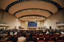 Members of the new Iraqi parliament attend a session at the parliament headquarters in Baghdad