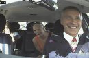 Still image taken from video shows Norwegian PM Stoltenberg and two passengers laughing, after they realised he was driving a taxi in Oslo