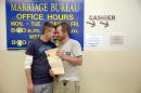 William Roletter, left, and Paul Rowe, press close to one another after they had their photo made with their newly acquired marriage certificate, Wednesday, May 21, 2014, at City Hall in Philadelphia. On Tuesday, Pennsylvania became the final Northeastern state and the 19th in the U.S. to legalize same-sex marriage. Republican Gov. Tom Corbett said Wednesday he would not appeal a federal judge's ruling that overturned the state's 1996 ban. (AP Photo/Matt Rourke)