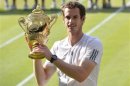 Andy Murray of Britain holds the winners trophy after defeating Novak Djokovic of Serbia in their men's singles final tennis match at the Wimbledon Tennis Championships, in London