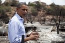 President Barack Obama talks with media as he tours the Mountain Shadow neighborhood devastated by raging wildfires, Friday, June 29, 2012, in Colorado Springs, Colo. (AP Photo/Carolyn Kaster)