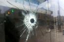 A bullet hole in the window of a shop in the Anbar provincial capital Ramadi on January 5, 2013