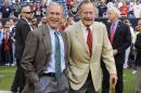 FILE - This Oct. 25, 2009 file photo shows former Presidents George H. W. Bush, right, and George W. Bush before the Houston Texans NFL football game against the San Francisco 49ers in Houston. George H. W. Bush and George W. Bush are cooperating with a historian for a joint biography about the former presidents. 