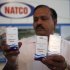 FILE – In this March 13, 2012 file photo, Natco Pharma Ltd. Secretary and General Manager Legal and Corp. Affairs M. Adinarayana displays Sorafenib Tosylate drugs meant for cancer treatment, at the company’s head office in Hyderabad, India. India's patent appeals office on Monday, March 4, 2013, rejected international drug maker Bayer AG's plea to stop Indian company Natco Pharma Ltd. from manufacturing a cheaper generic version of a patented cancer drug. Bayer Corp., a subsidiary of the German pharma giant in Pittsburgh, Pennsylvania, markets sorefinib as Nexavar for about $5,600. Natco's version would cost Indian patients $175 a month. (AP Photo/Mahesh Kumar A., File)