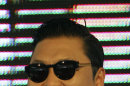 South Korean rapper PSY, who sings the popular "Gangnam Style," smiles while greeting Thai fans during a press conference in Bangkok, Thailand, Wednesday, Nov. 28, 2012. PSY will perform in Thailand on Wednesday night - his first show in Asia outside of South Korea. (AP Photo/Sakchai Lalit)