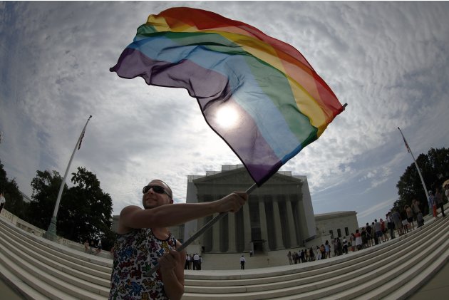 A gay marriage supporter waves a rainbow flag outside U.S. Supreme Court in Washington