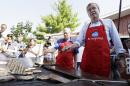 Republican presidential candidate, former Florida Gov. Jeb Bush, works the grill in the Iowa Pork Producers tent during a visit to the Iowa State Fair, Friday, Aug. 14, 2015, in Des Moines, Iowa. (AP Photo/Charlie Neibergall)