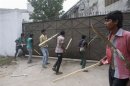Garment workers try to break gate of factory during protest to demand capital punishment for those responsible for collapse of Rana Plaza building in Savar