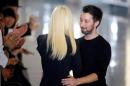 Italian designer Donatella Versace greets designer Anthony Vaccarello at the end of his Autumn/Winter 2015/2016 women's ready-to-wear collection show during Paris Fashion Week