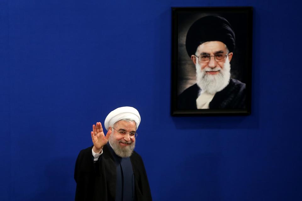 FILE - In this Saturday, Aug. 29, 2015 file photo, Iran&#39;s President Hassan Rouhani waves to reporters at the conclusion of his press conference in...