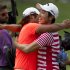 ADDS NAME OF GOLFER ON LEFT SEUNG-YUI NOH - Sang-Moon Bae of South Korea is congratulated by Seung-Yui Noh, also of South Korea, on the 18th green after Bae won the Byron Nelson golf tournament Sunday, May 19, 2013, in Irving, Texas. (AP Photo/Tony Gutierrez)