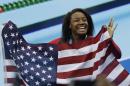 United States' Simone Manuel celebrates winning the gold medal in the women's 100-meter freestyle during the swimming competitions at the 2016 Summer Olympics, Friday, Aug. 12, 2016, in Rio de Janeiro, Brazil. (AP Photo/Natacha Pisarenko)
