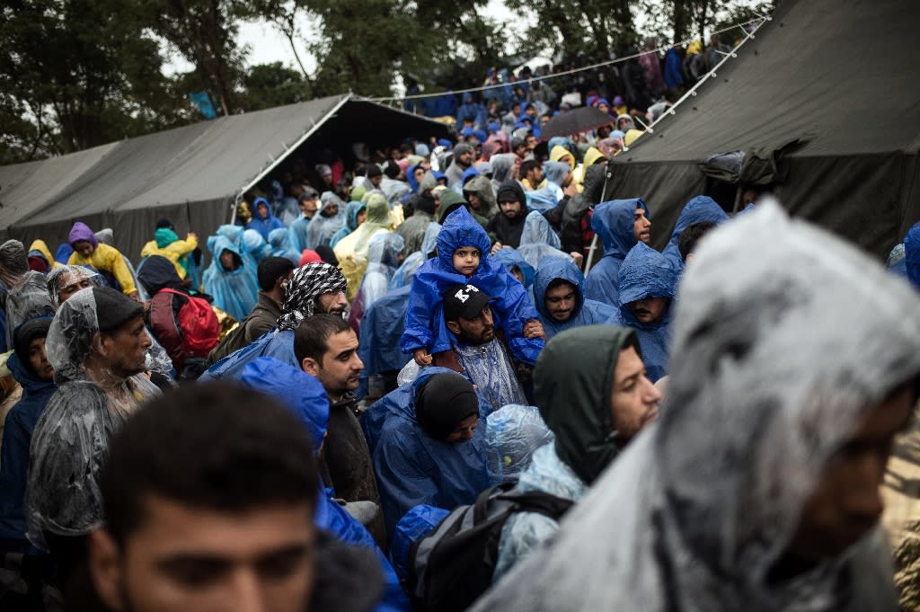 Migrants cross the Serbia-Croatia border after being stranded