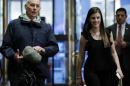 Retired Marine Corps general John Kelly is escorted by Madeleine Westerhout (R) as he arrives at Trump Tower to meet with U.S. President-elect Donald Trump in New York