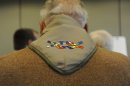 Dave Rice wears a neckerchief embroidered with the Inclusive Scouting Award while talking with supporters at the Equal Scouting Summit in Grapevine