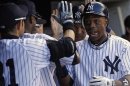 New York Yankees' Granderson is congratulated by teammates after hitting two-run home run against Tampa Bay Rays in New York