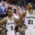 Spurs' Duncan, Parker and Leonard stand during a break in play against the Heat during Game 4 of their NBA Finals basketball series in San Antonio