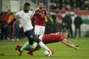 Alexander Tettey, left, of Norway and Balazs Dzsudzsak of Hungary fight for the ball during the Hungary vs Norway soccer European Championship qualification playoff second leg match in Groupama Arena in Budapest, Hungary, Sunday, Nov. 15, 2015. (Szilard Koszticsak/MTI via AP)