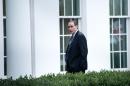 Former White House advisor David Axelrod walks into the West Wing of the White House on November 15, 2013 in Washington