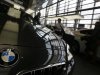 Customers walk around cars of German premium automaker BMW at the headquarters in Munich