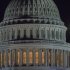The moon rises behind the U.S. Capitol Dome in Washington as Congress works into the late evening, Sunday, Dec. 30, 2012 to resolve the stalemate over the pending "fiscal cliff." (AP Photo/J. David Ake)
