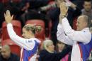 Karolina Pliskova, left, from the Czech Republic, and coach Petr Pala salute the crowd after defeating Canada's Gabriela Dabrowski, Sunday, Feb. 8, 2015, at the Fed Cup tennis tournament in Quebec City. (AP Photo/The Canadian Press, Francis Vachon)