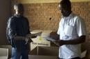 Officials of Burundi's National Electoral Commission take stock of electoral material for the upcoming parliamentary elections at a warehouse in the neighbourhood of Nyakabiga near the capital Bujumbura
