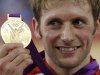 Britain's Jason Kenny stands with his gold medal during the victory ceremony after the track cycling men's sprint gold finals at the Velodrome during the London 2012 Olympic Games