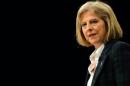 British Home Secretary Theresa May speaks in Manchester on September 30, 2013